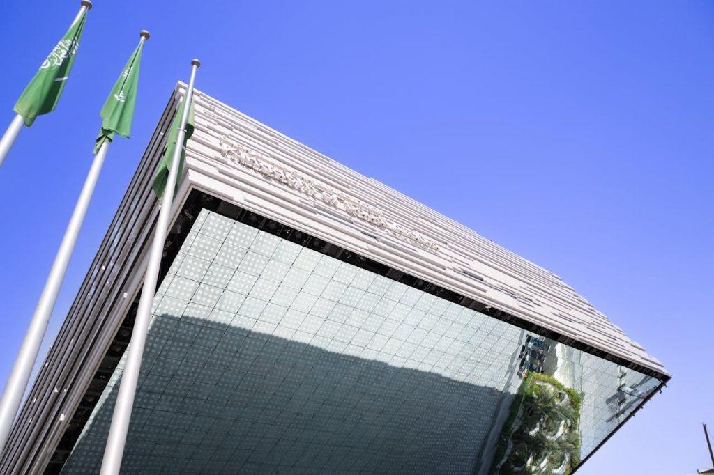 Flags of Saudi Arabia near Modern Building